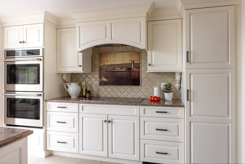 Antique White Cabinetry and Decorative Backsplash