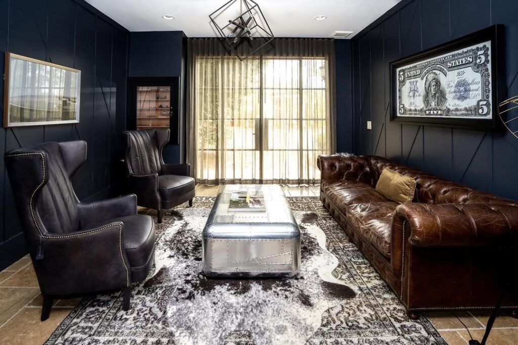 Navy Walls in a Vintage Leather Living Room