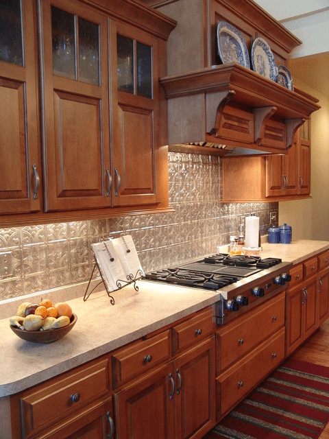 Maple Cabinets With Textured Backsplash
