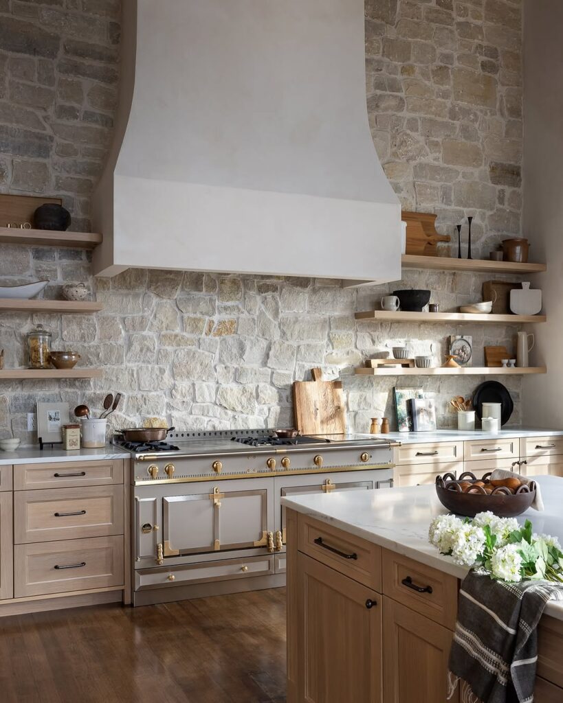 Stone Wall Kitchen with a Brass Range