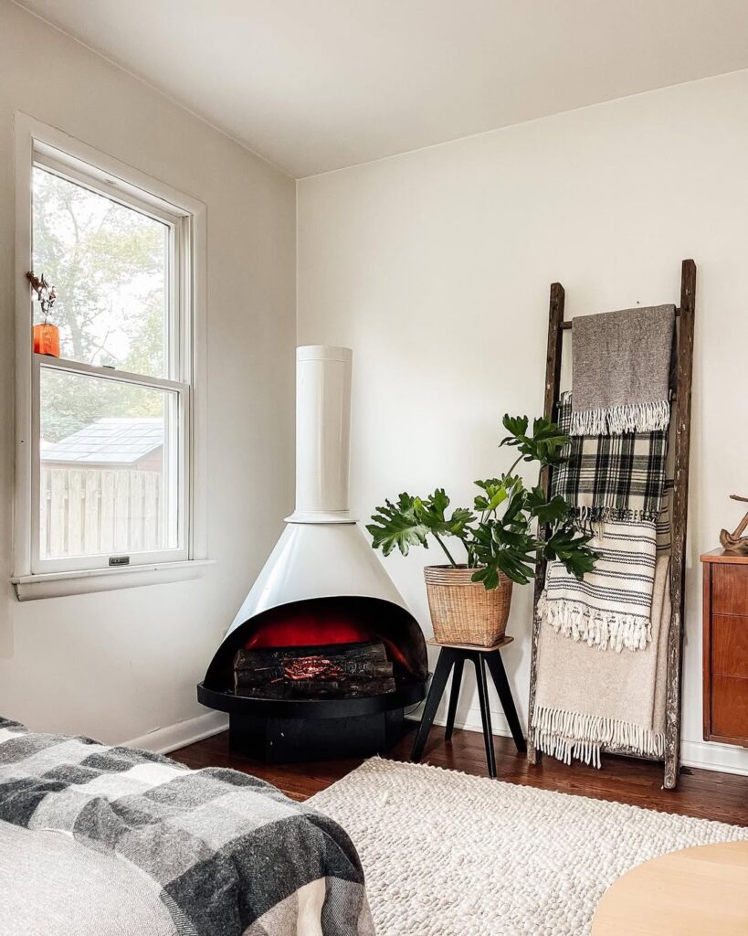 A mid-century fireplace in a cozy bedroom corner
