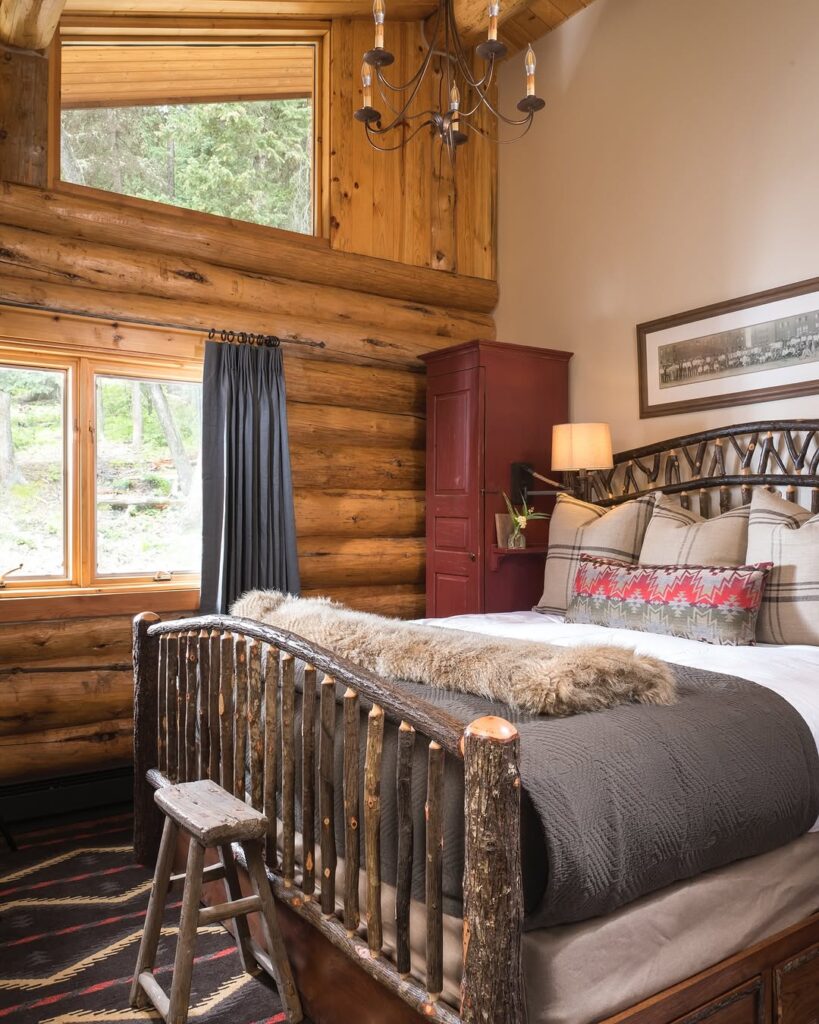 Plaid Warmth in a Log Cabin Bedroom