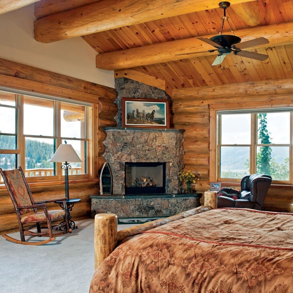Rustic Stone Fireplace in a Log Cabin Bedroom