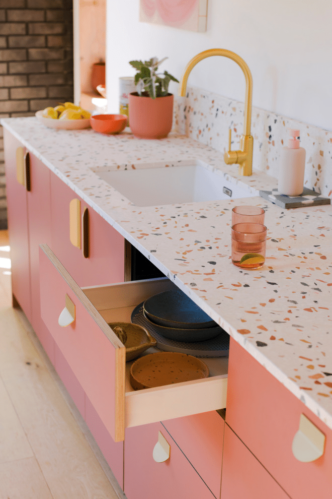Pink Cabinetry and Terrazzo Countertops