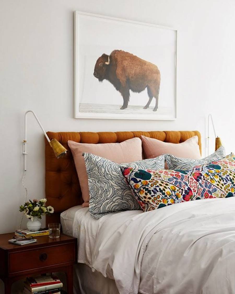 9cc7066505ba82130687b54753540dd8-40126 Mixing multiple pillow patterns against a burnt orange headboard is so creative.