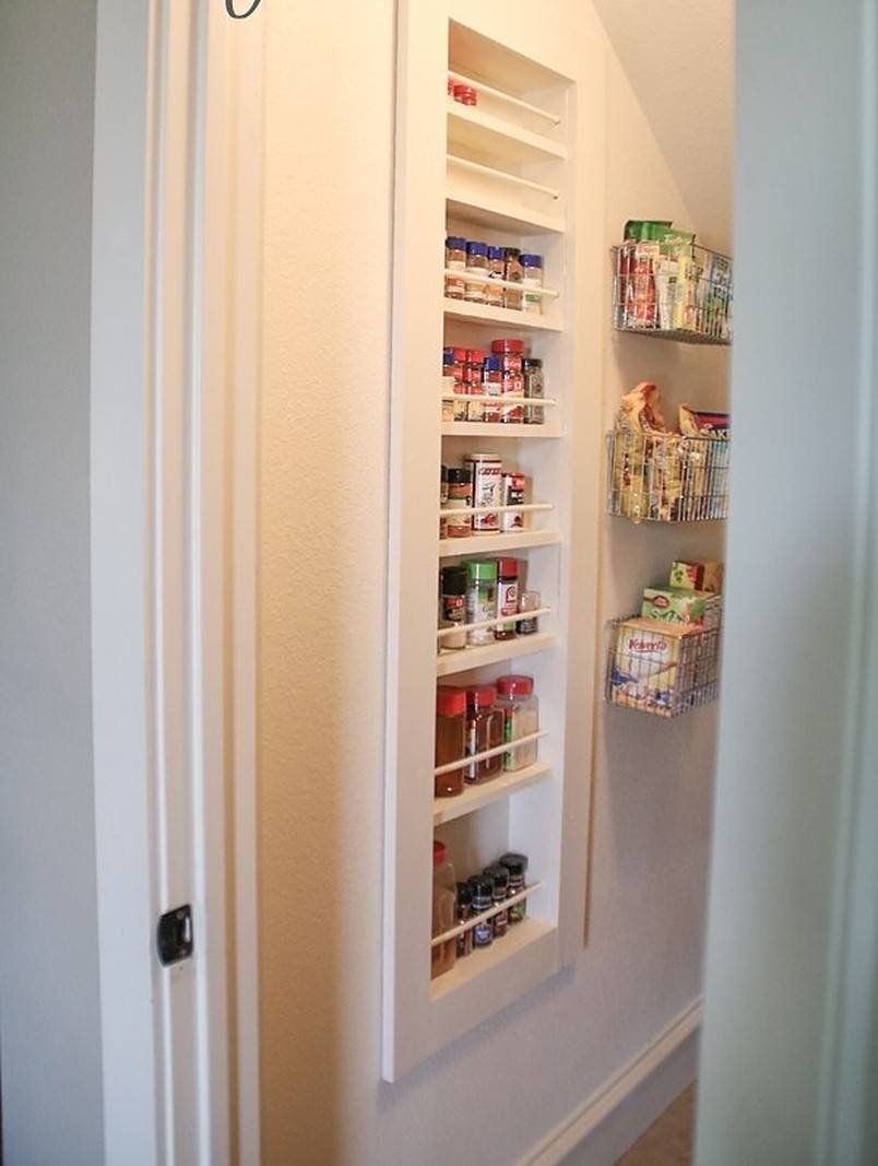 Built-in spice rack in white wall