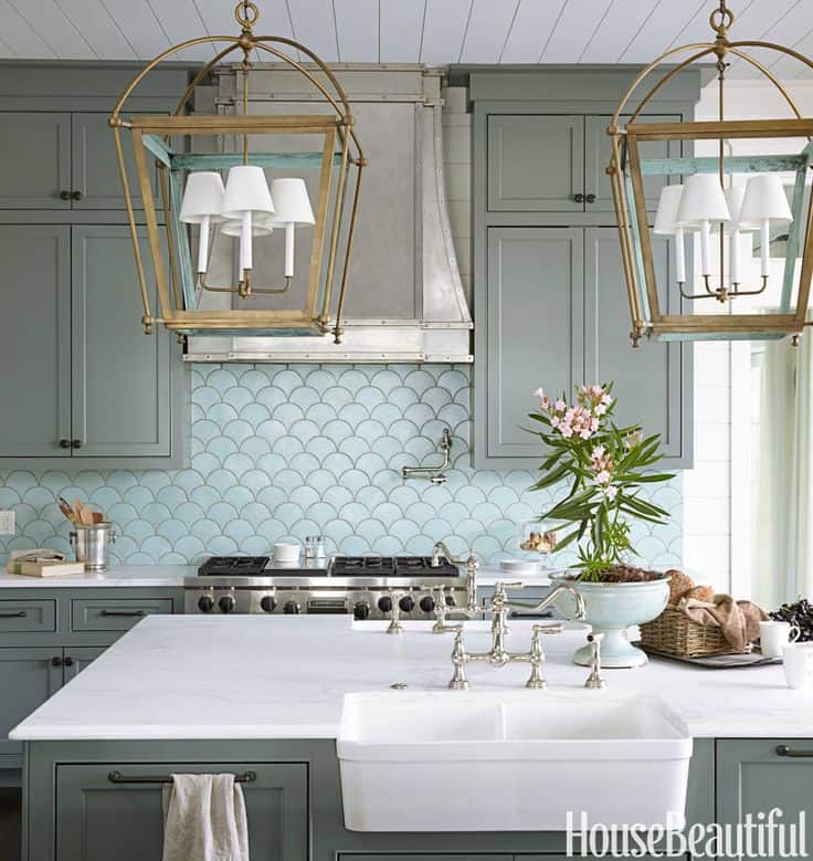 coastal-style-kitchen-with-large-latern-like-lights-and-carrara-marble-counter-tops