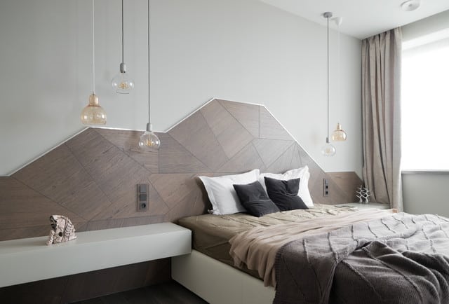 Eccentric and modern home bedroom with a geometric headboard