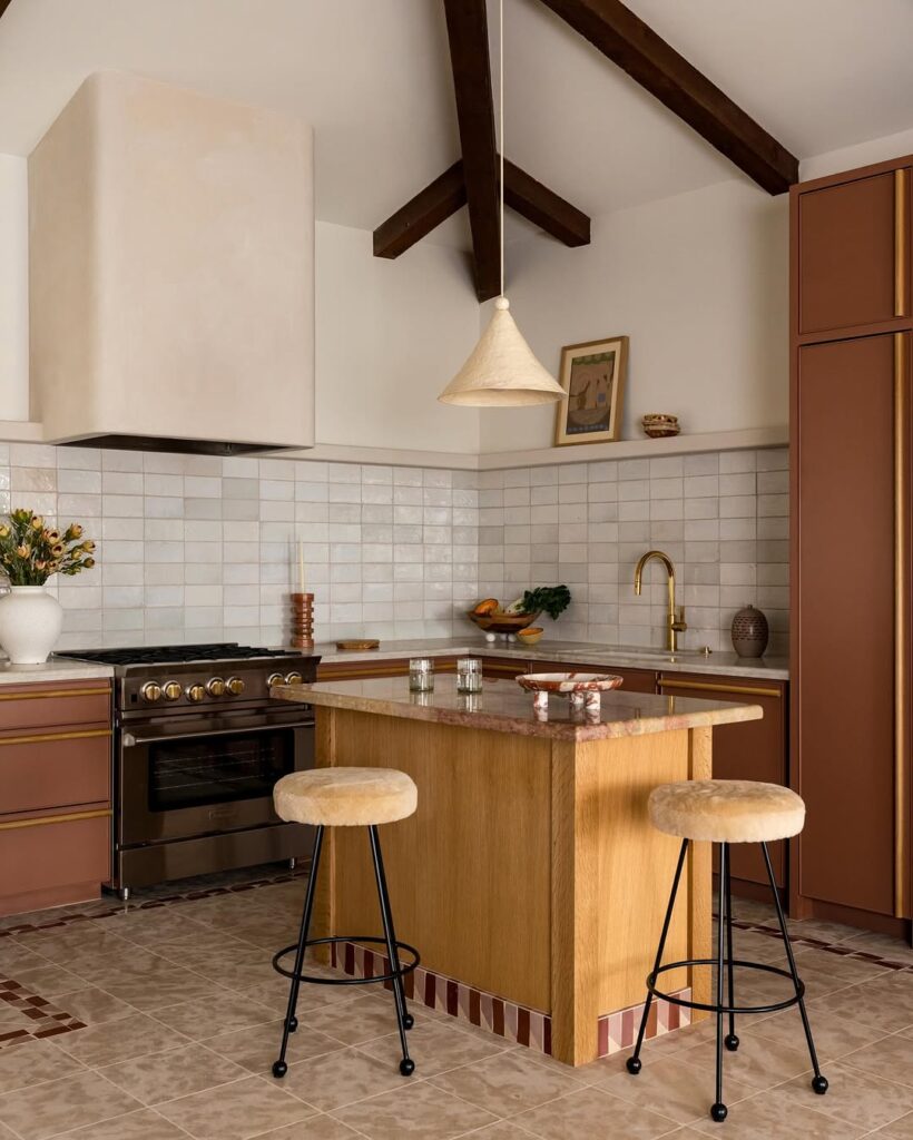 Golden Accents on Terracotta Cabinetry