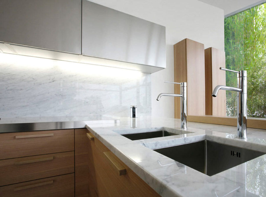 a contemporary kitchen with marble countertops a contemporary kitchen with marble countertops