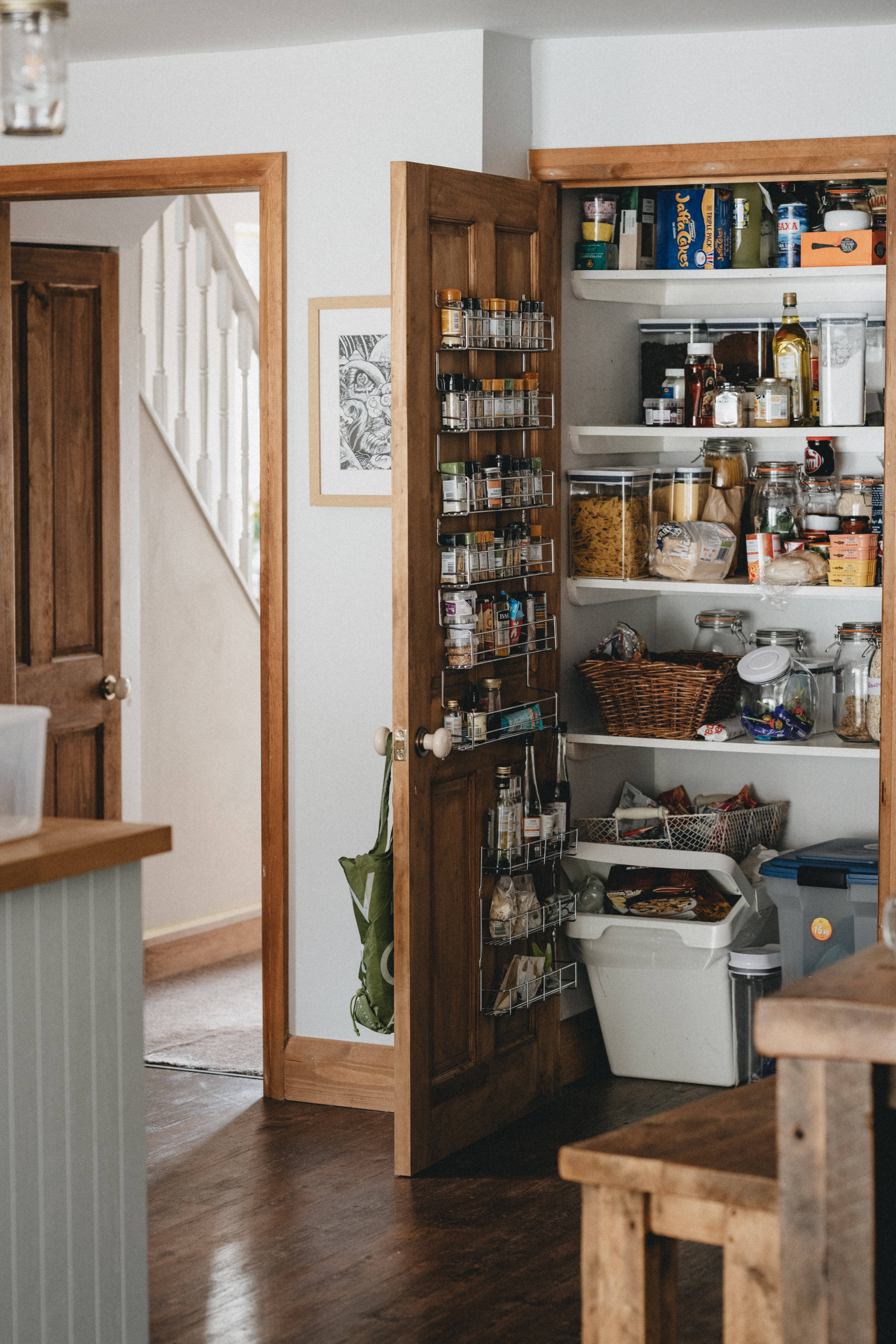 open-pantry-door-with-spice-rack-24153 An open pantry door showing off a mounted spice rack