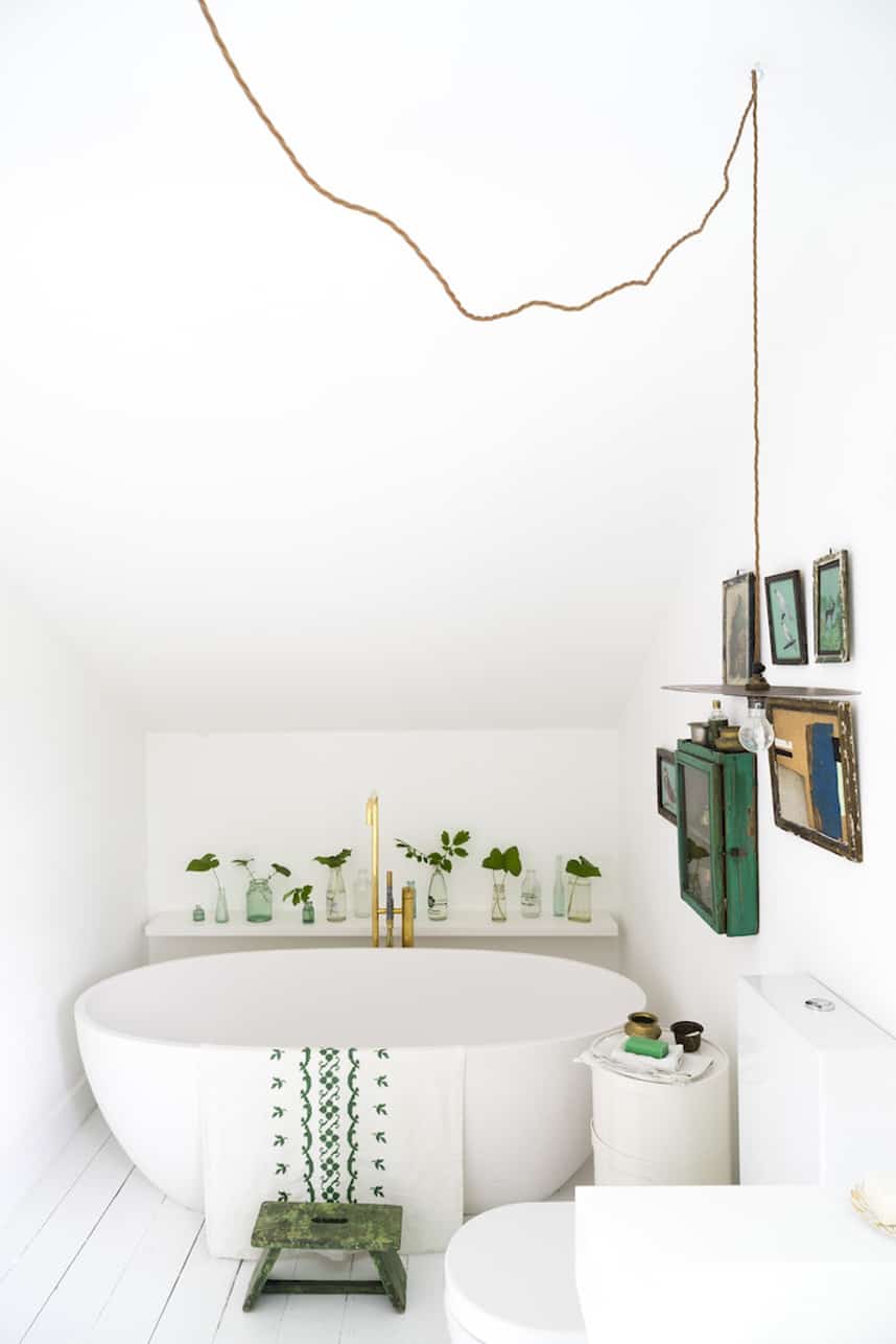 Small white bathroom with green accents
