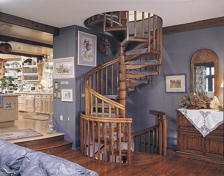 Space around the spiral oak staircase defines its style [From: The Iron Shop]