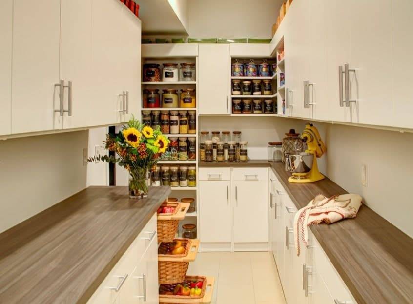 Walk-in pantry with cabinets and sliding drawers