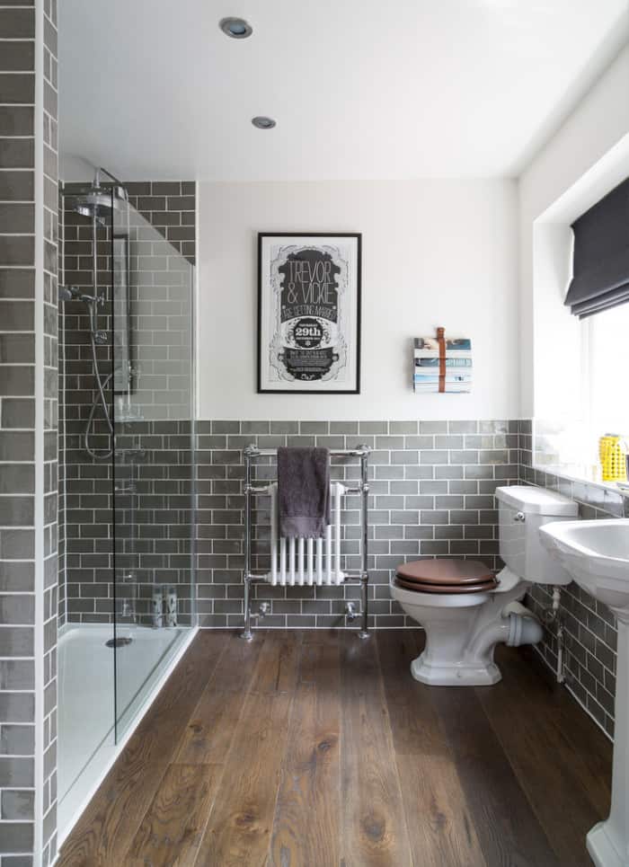 wood tile bathroom with charcoal subway tile