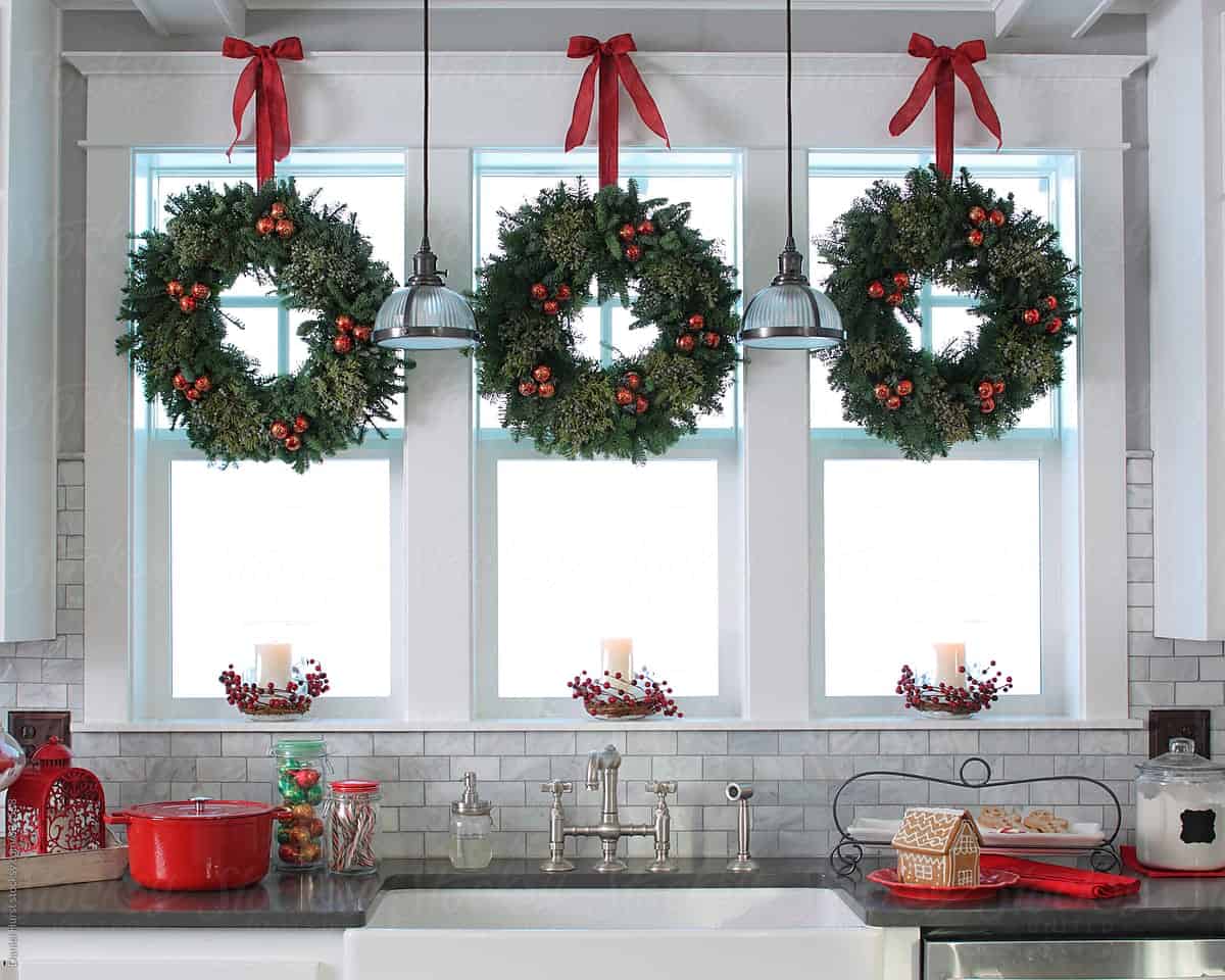 wreaths on window chirstmas kitchen