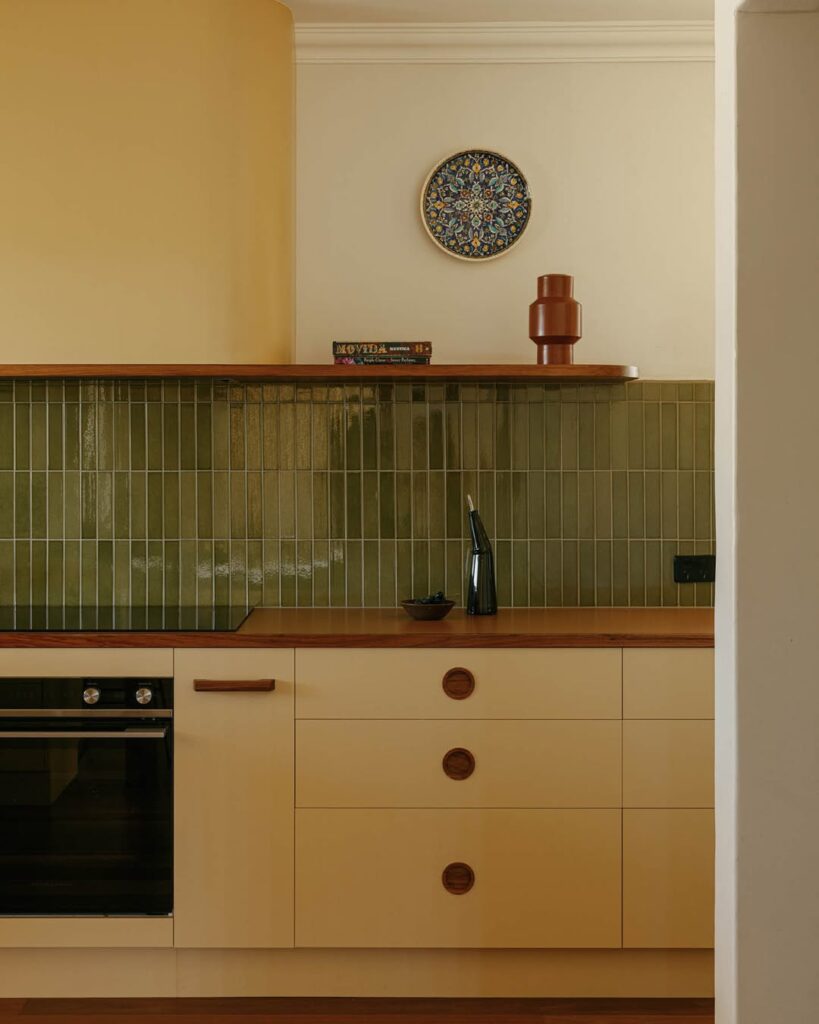 Wood Countertop With Yellow Cabinetry