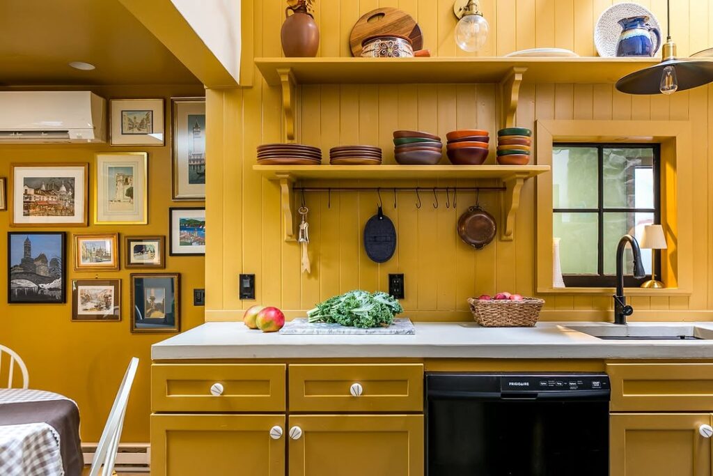 Yellow Base Cabinets with Open Shelving