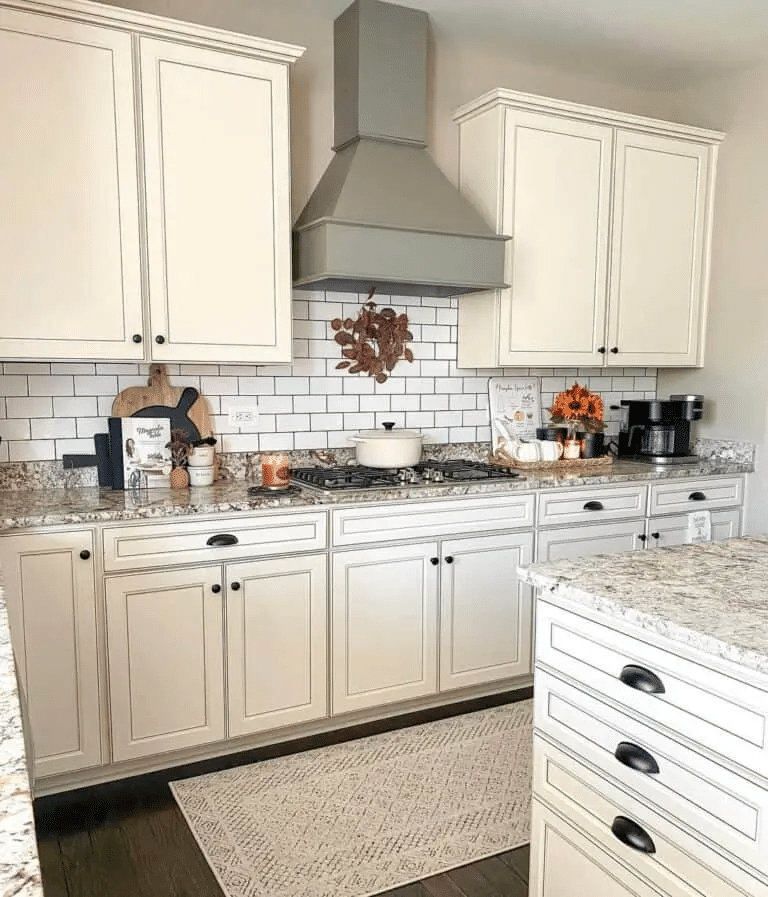 Decorative Backsplash with Cream Cabinetry