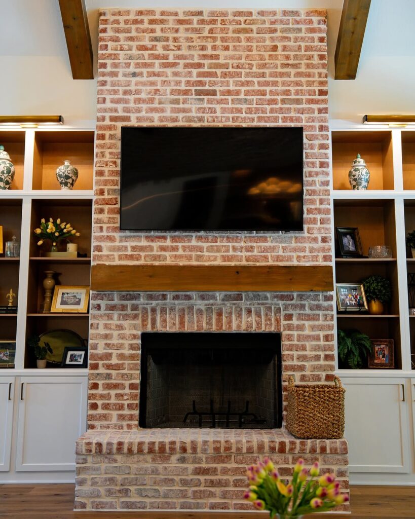 Hearth of Warm Red Brick Paired with a Rustic Timber Beam