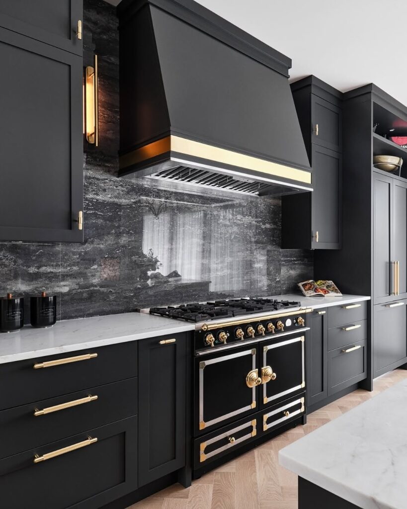Gold Accents on Black Cabinets in a Statement Range