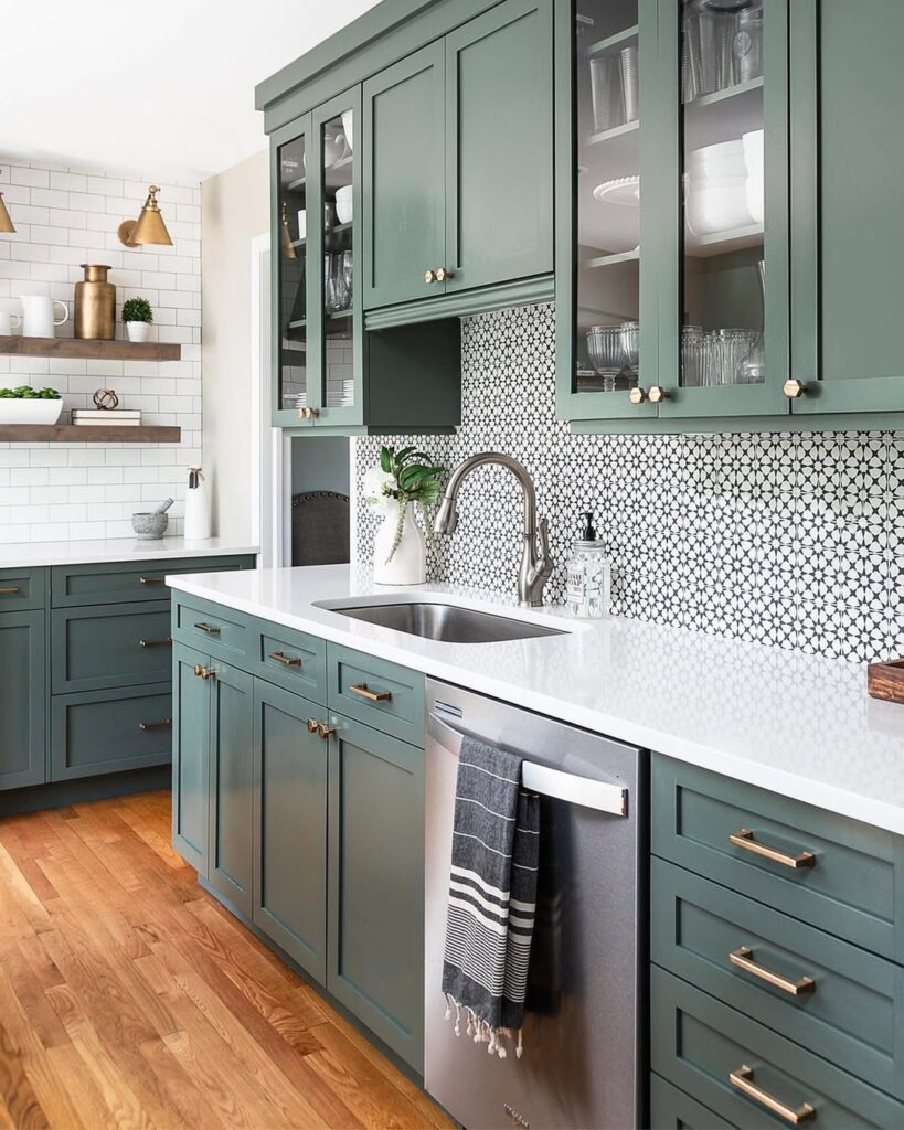 A Kitchen with Pattern and Dark Green Cabinets