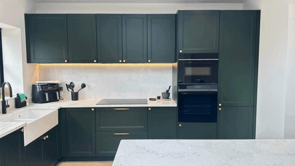 Dark Green Kitchen Cabinetry with Built-In Lighting