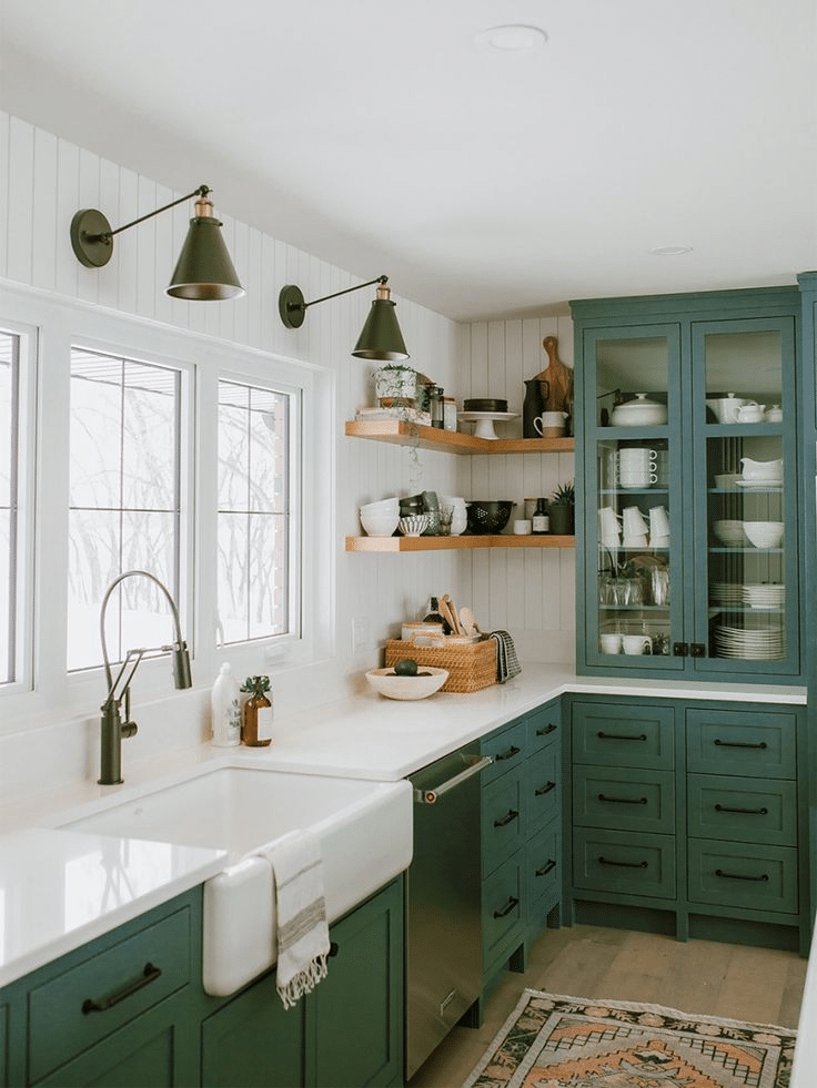 Open shelving paired with dark green matte cabinetry