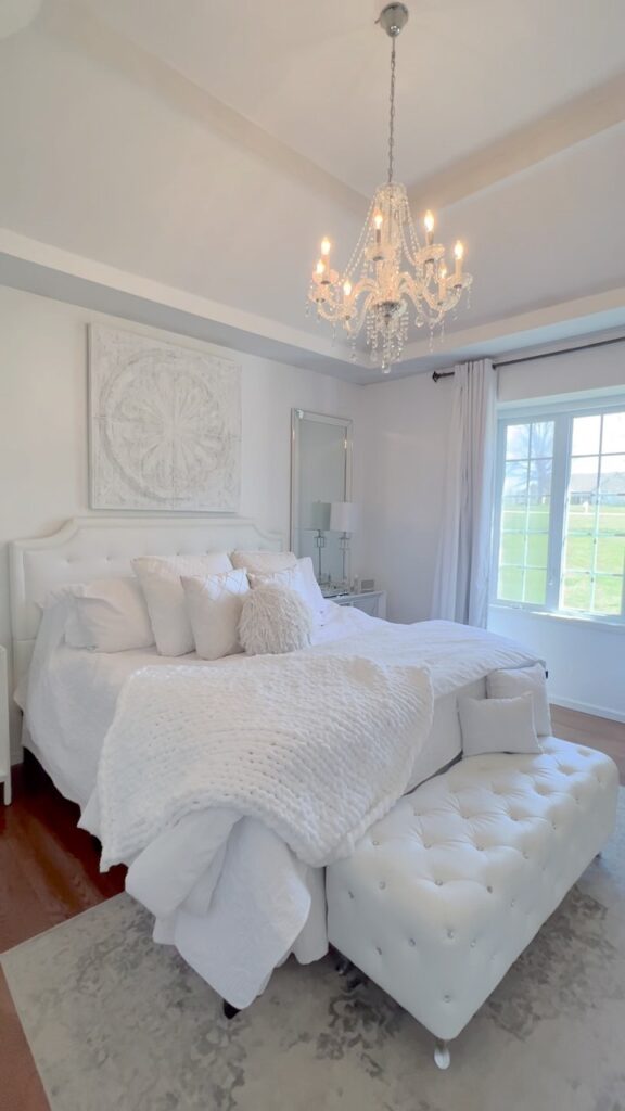 Elegant White Bedroom and Crystal Chandelier