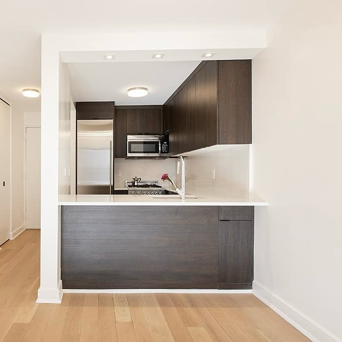 Light wood floors with dark cabinets