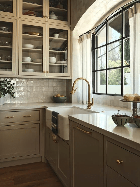 White Countertops and Taupe Cabinetry