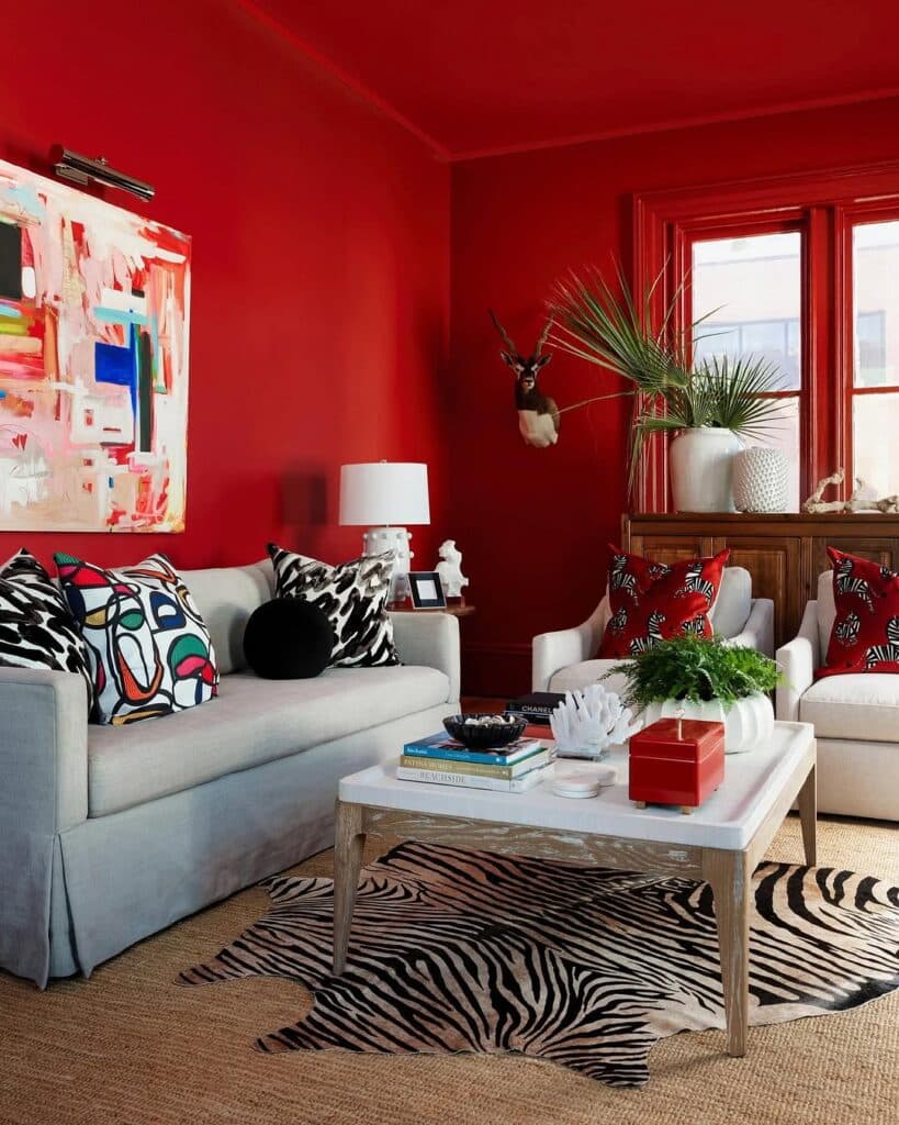 A cherry red living room with an eclectic statement style