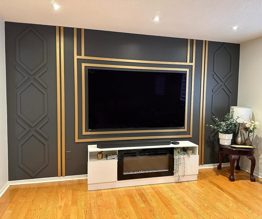 Art Deco Charcoal Frame Wall with Gold Accent Behind TV