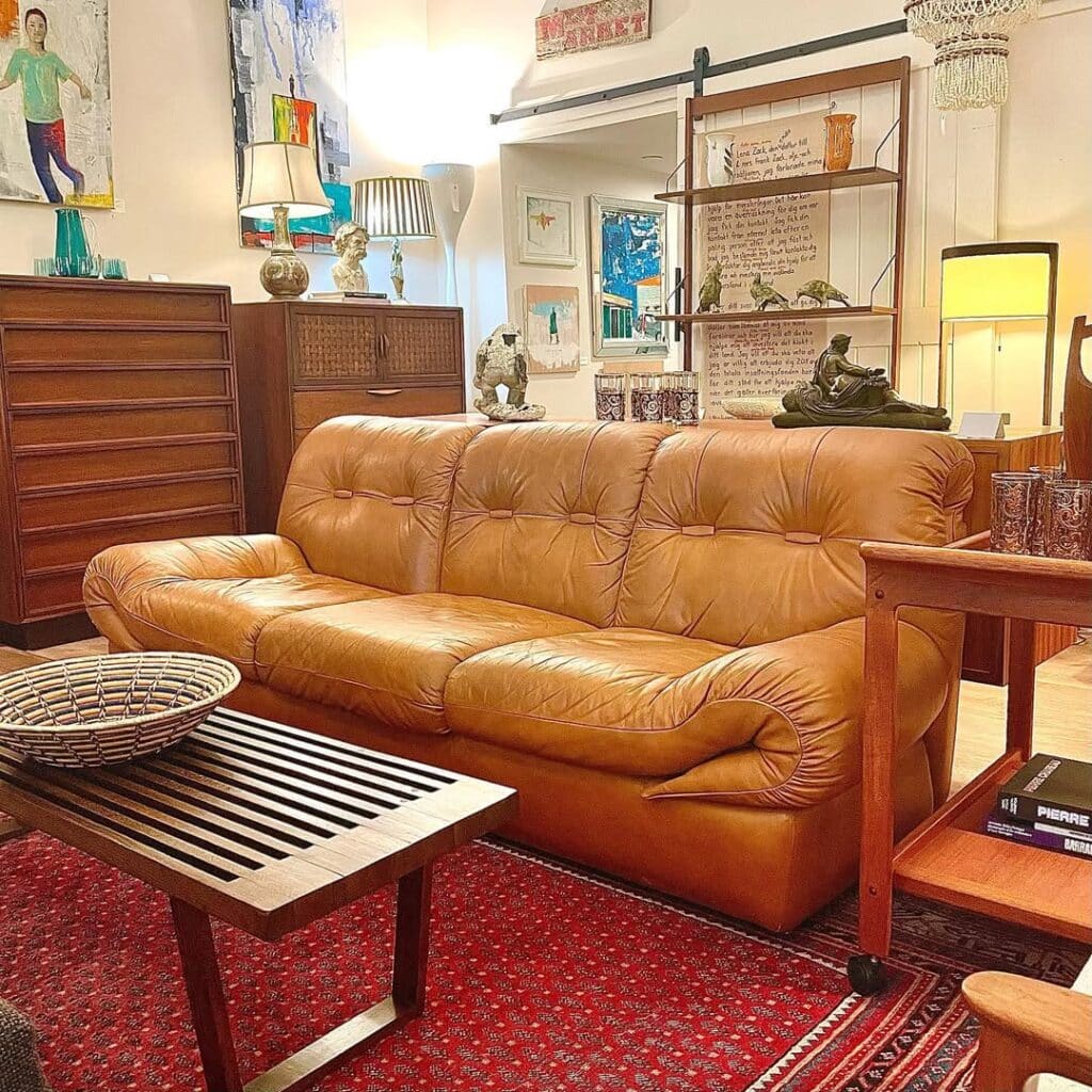 Artisan Accents Beside a Tufted Cognac Leather Sofa