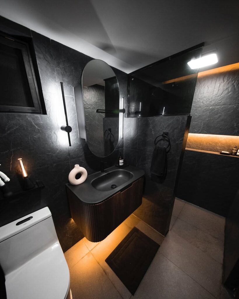 Black Bathroom with Dark Stone and Ambient Lighting