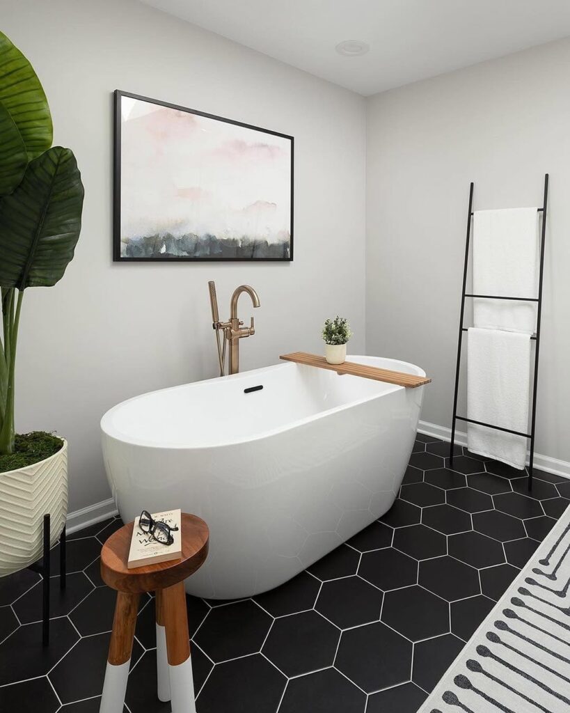Black Hex Floor Bathroom With a Minimal Freestanding Tub