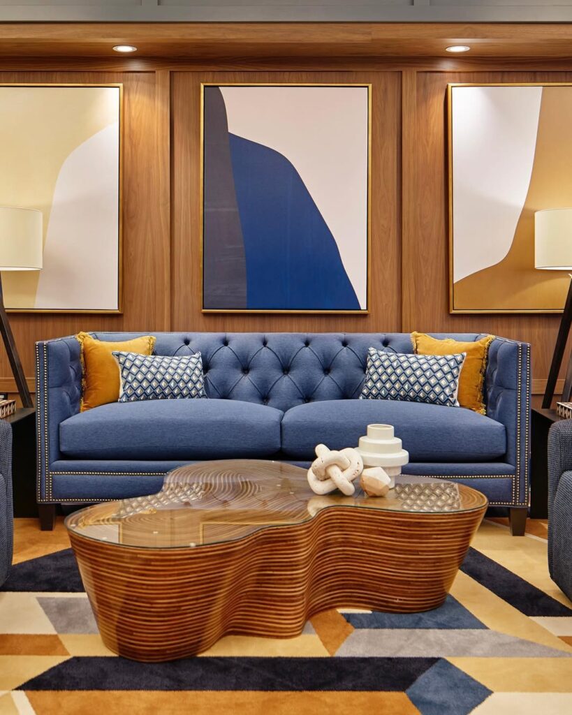 Blue Tufted Sofa and Walnut Trim