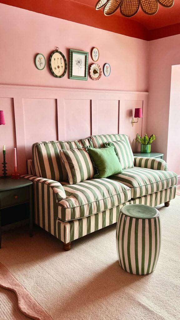 Blush Paneling with a Green Striped Sofa