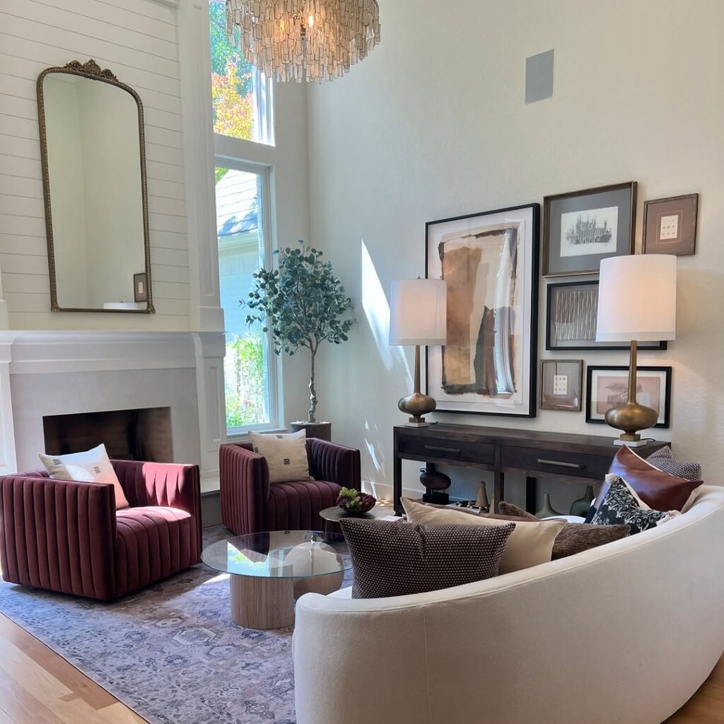 Burgundy Accents Around a Cream Sofa