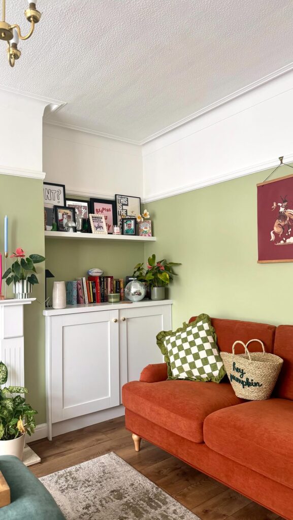 Burnt Orange Seating with Muted Sage Walls