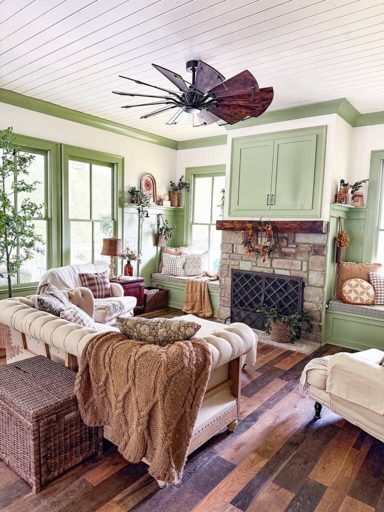 Cottage Living Room Hearth with Sage Trim