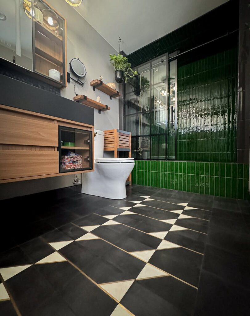 Emerald Green Bathroom with Geometric Black Flooring