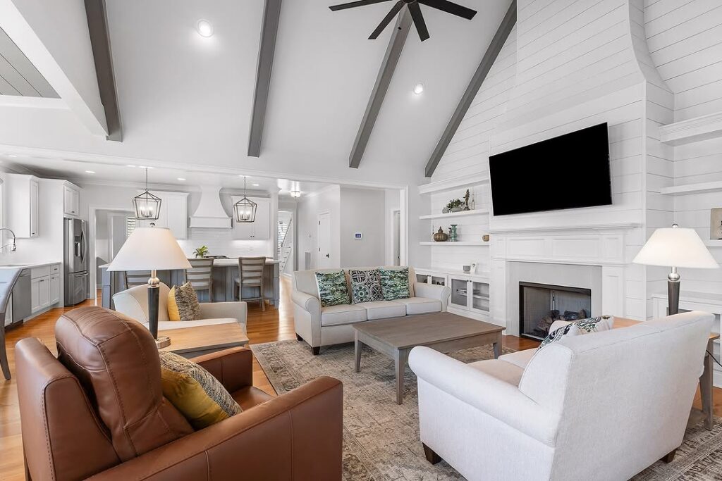Farmhouse Living Room With Shiplap Vault and Mixed Seating