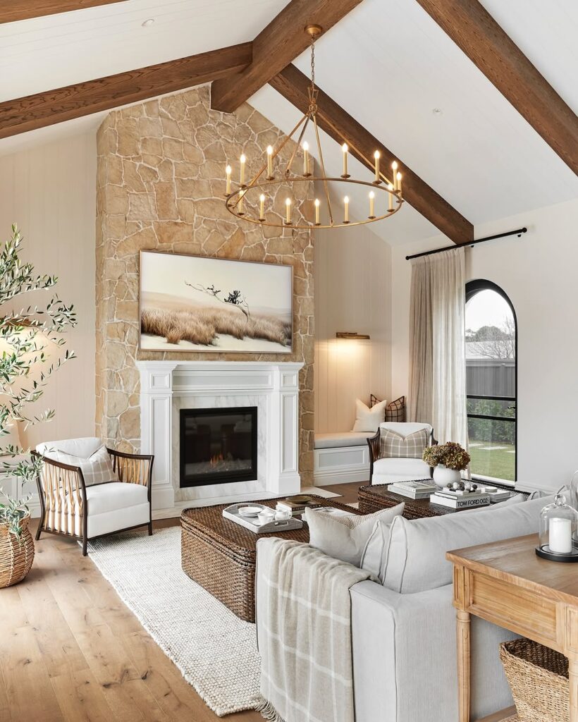 Farmhouse Living Room With Timber Beams and Stone Hearth