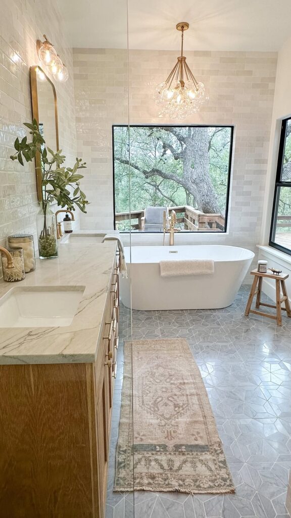 Farmhouse Tub with Brass Lantern and Window View