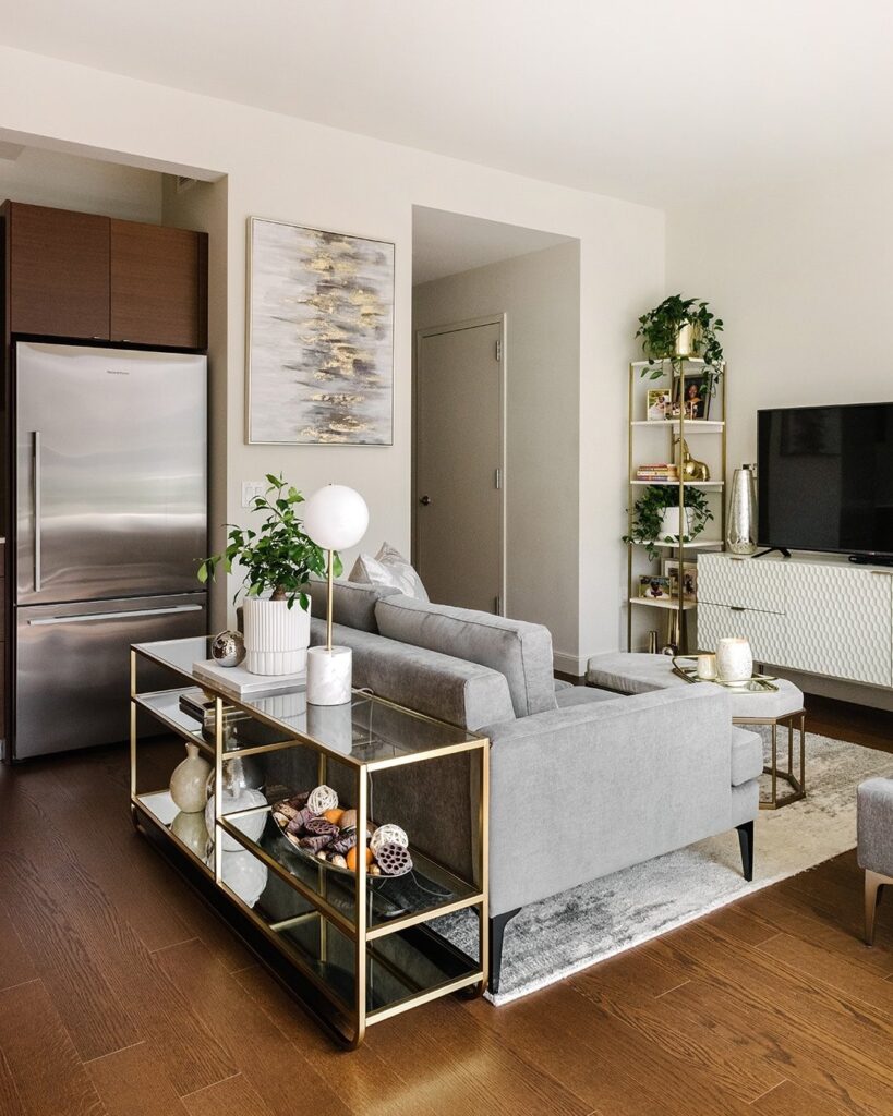 Glam Gold and Glass Console Behind the Sofa