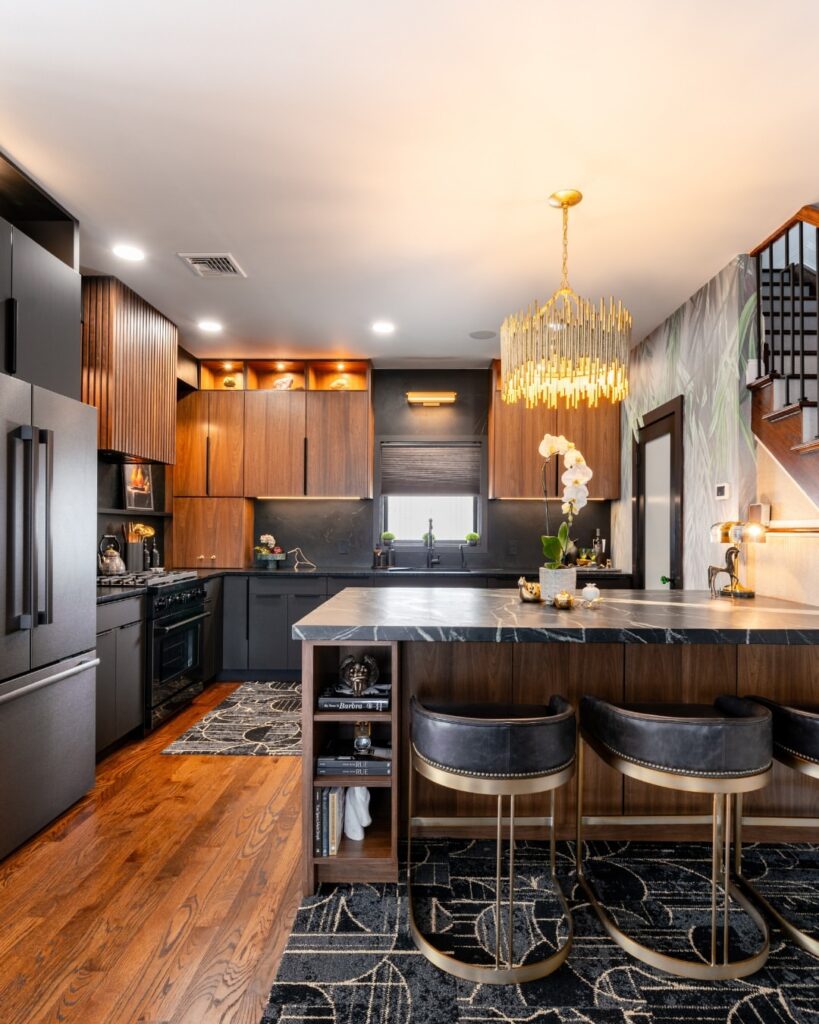 Gothic Kitchen with Gold Lighting and Dark Cabinetry