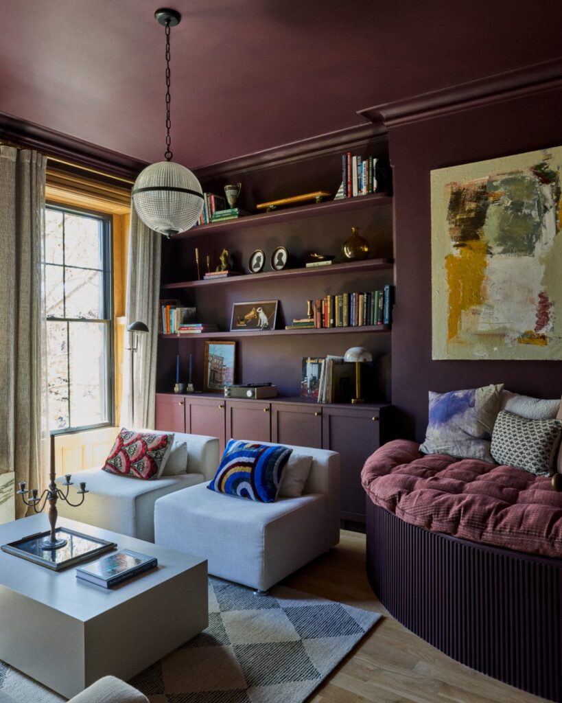 Living room library in plum and neutrals