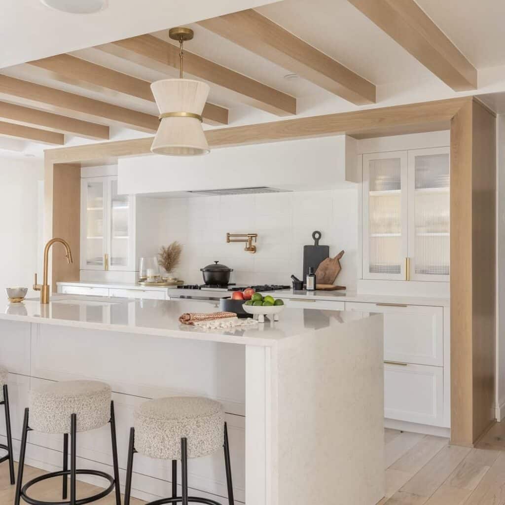 Minimalist Kitchen with White Cabinetry and Warm Wood Beams