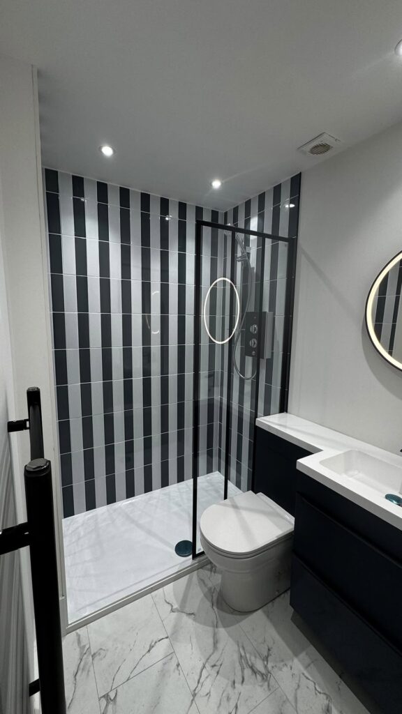 Modern Bathroom with Upright Black Stripe Tiles